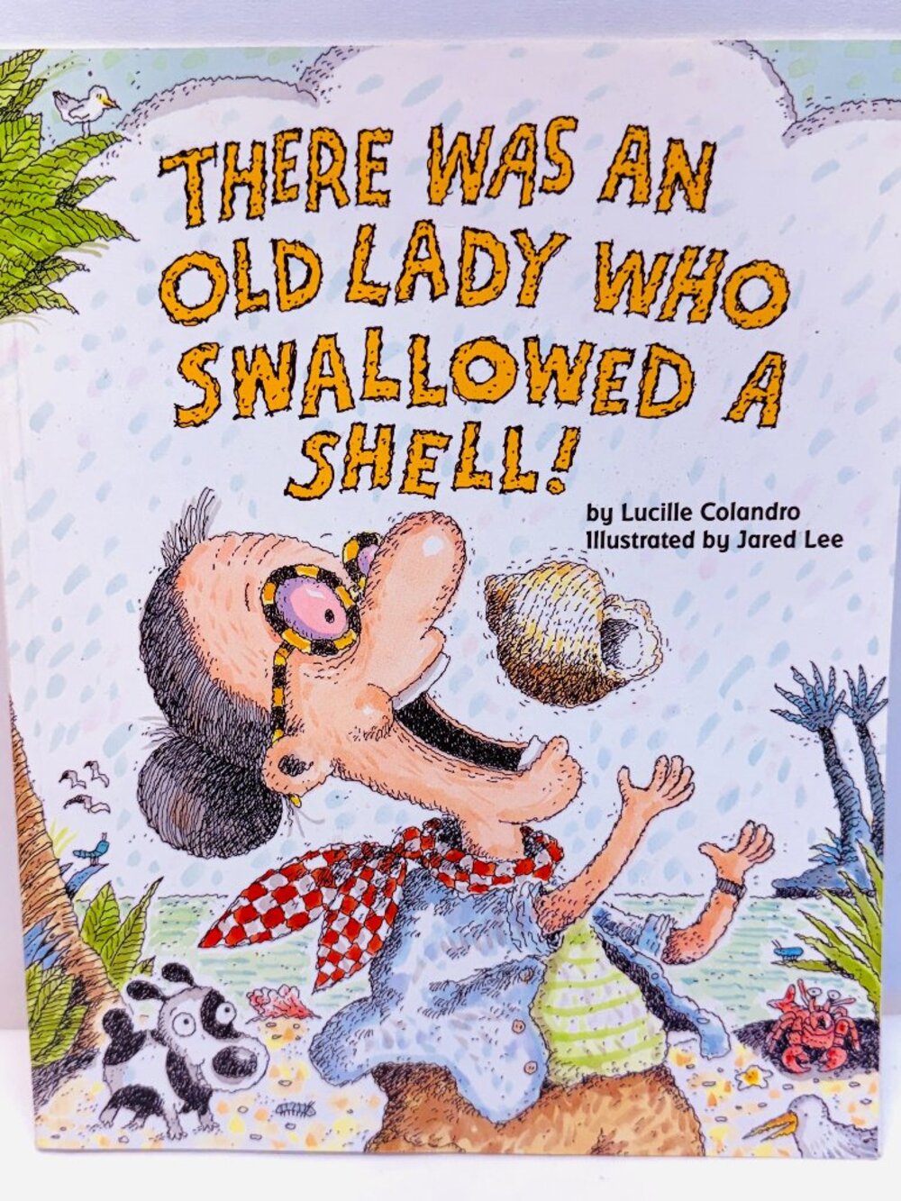 There Was an Old Lady Who Swallowed a Shell! Paperback by Lucille Colandro